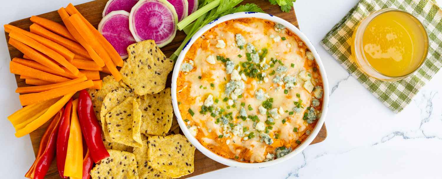 Buffalo chicken Dip in a bowl made with Applegate Naturals® Roasted Shredded Chicken Breast