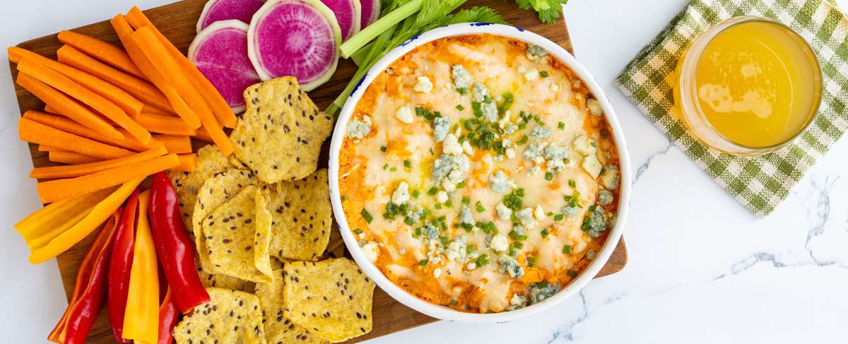 Buffalo chicken Dip in a bowl made with Applegate Naturals® Roasted Shredded Chicken Breast
