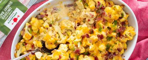 Cheesy Cauliflower with bacon in a baking dish